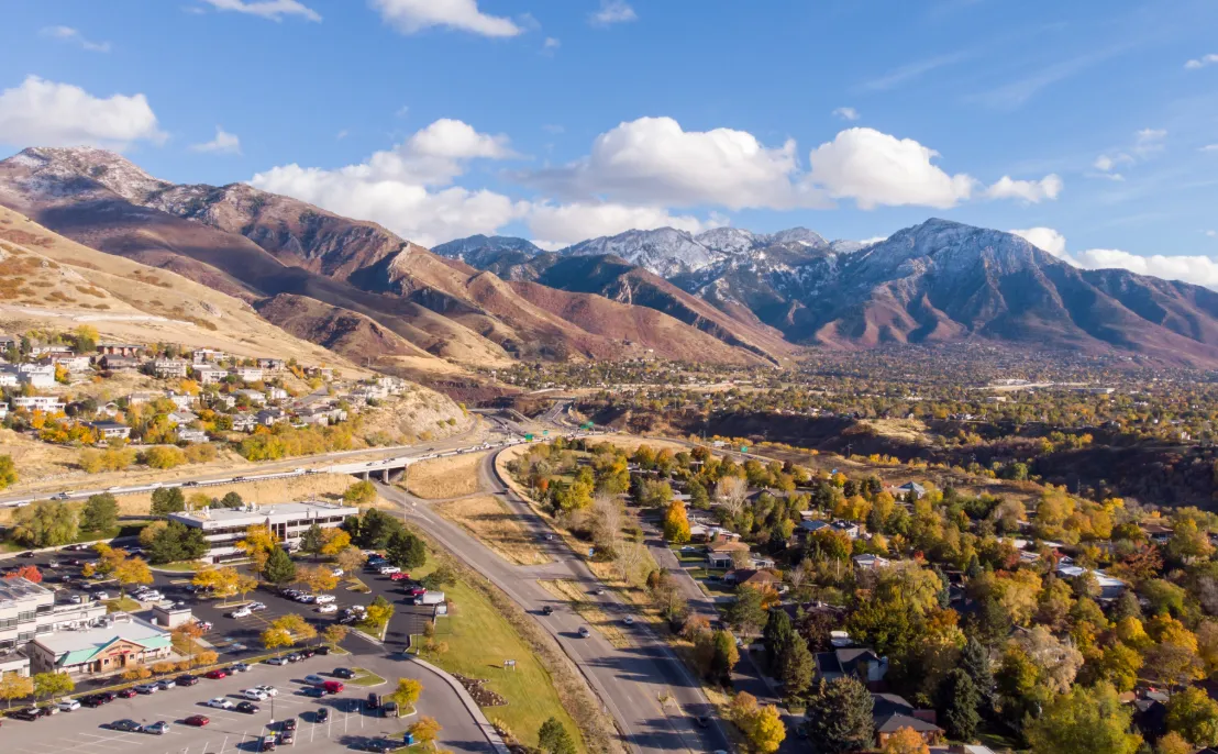Mountain valley neighborhood under a blue sky